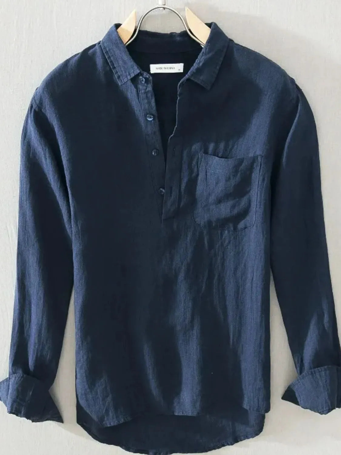 Model wearing button detail long sleeve blouse styled casually