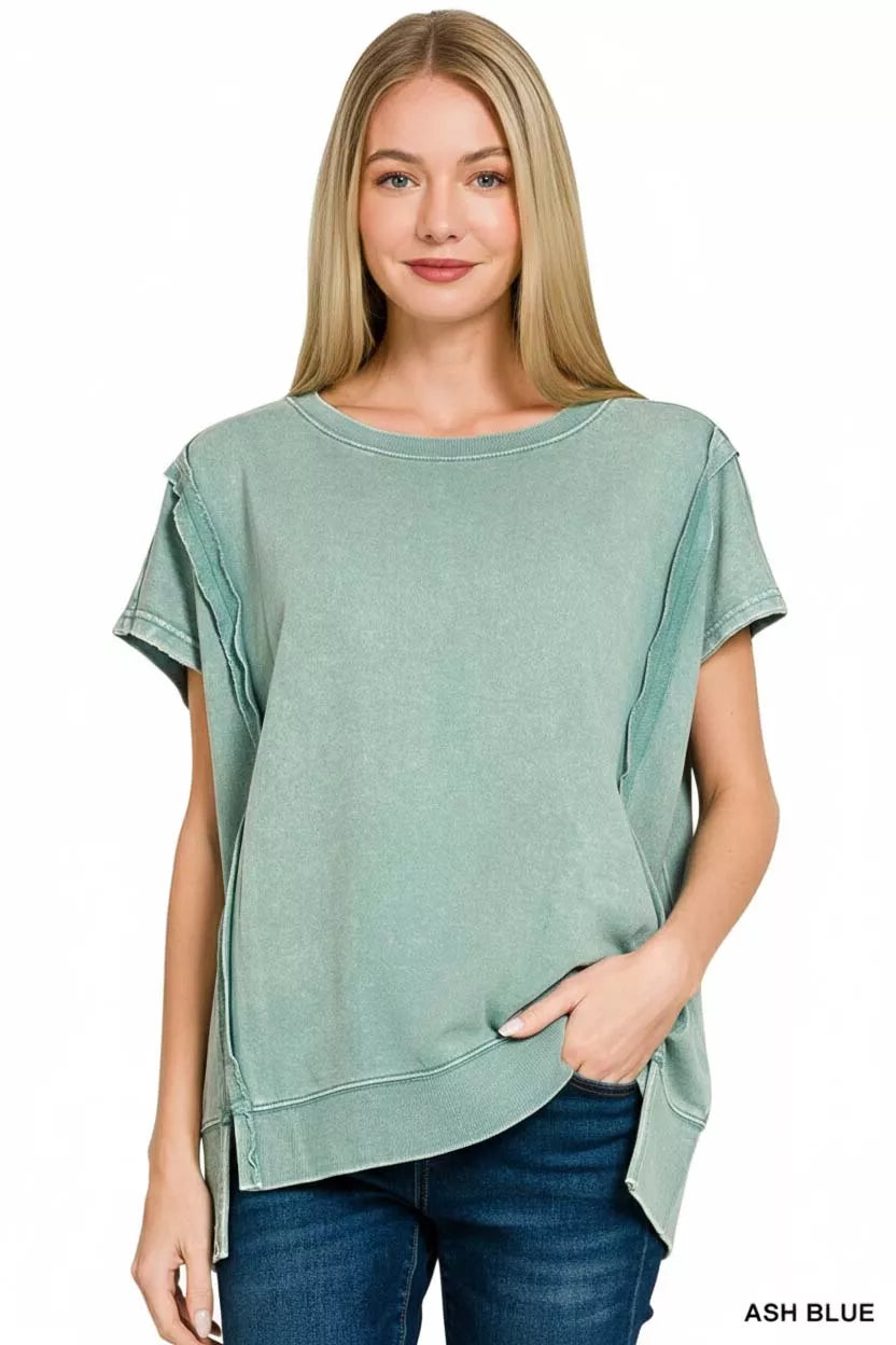 Close-up of acid wash texture and exposed seam detail on top