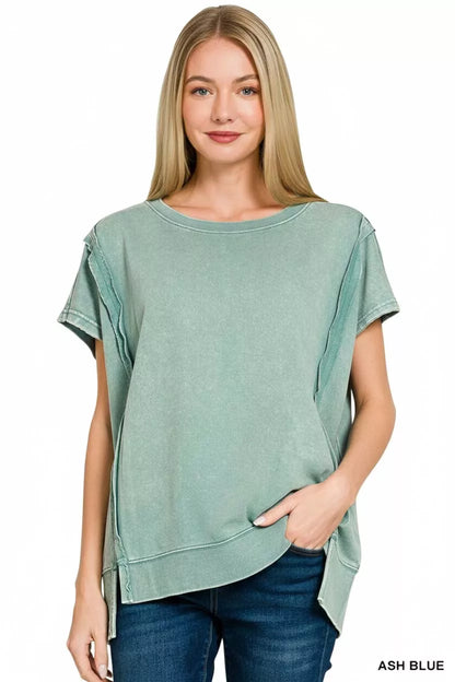 Close-up of acid wash texture and exposed seam detail on top