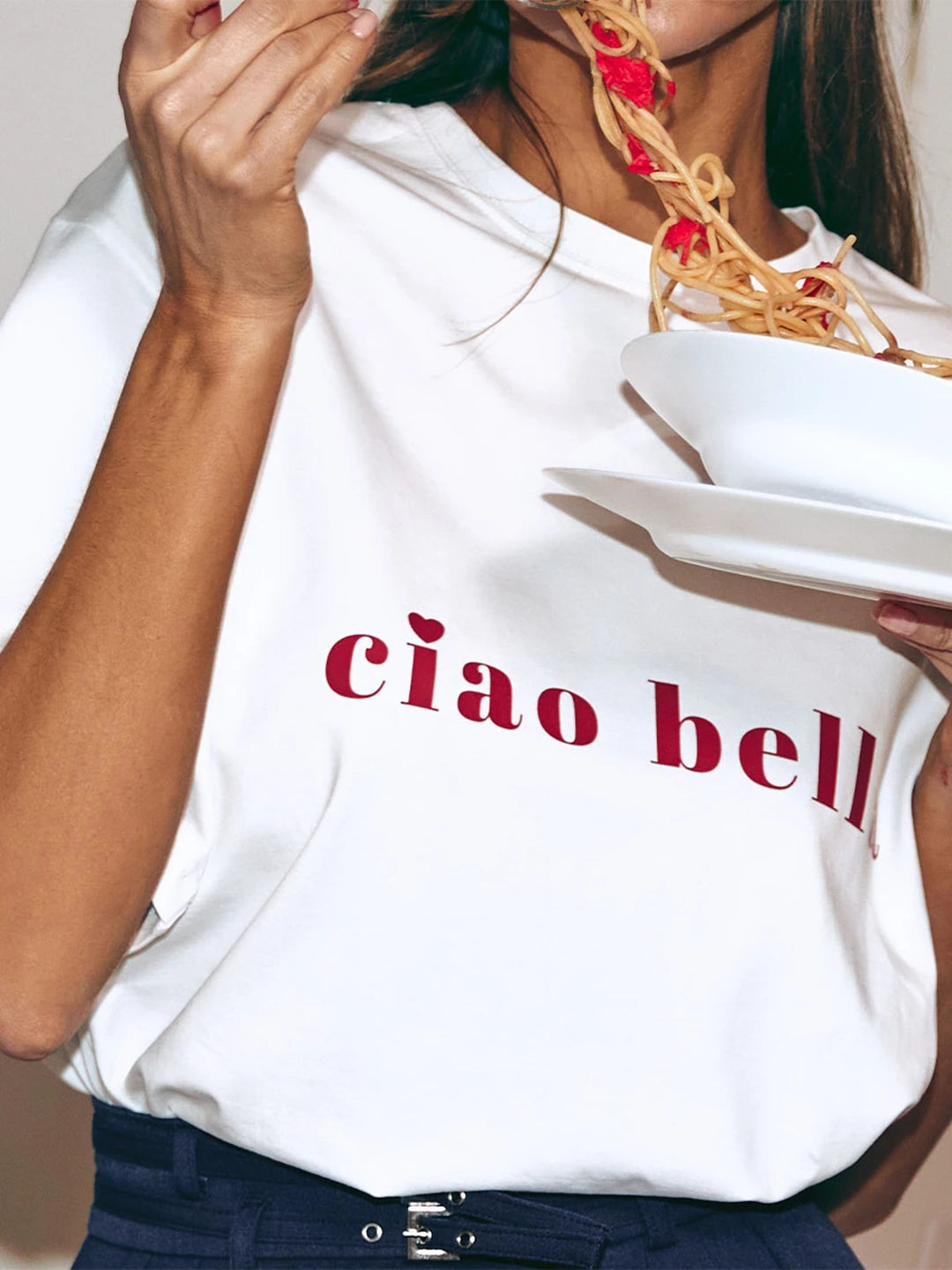 Close-up of premium cotton fabric and minimalist Ciao Bella print on oversized tee