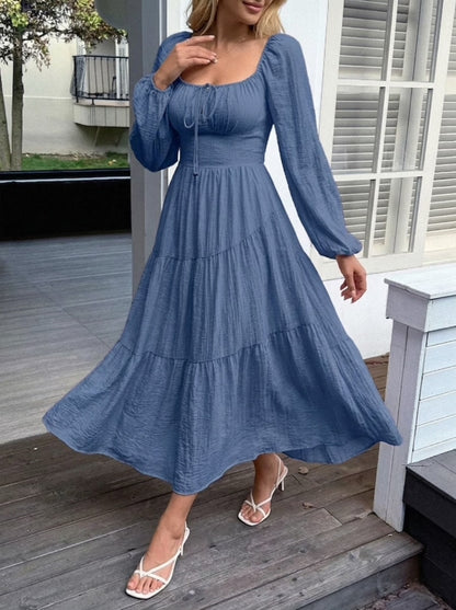 Close-up of ruched and tie detail on balloon sleeve midi dress