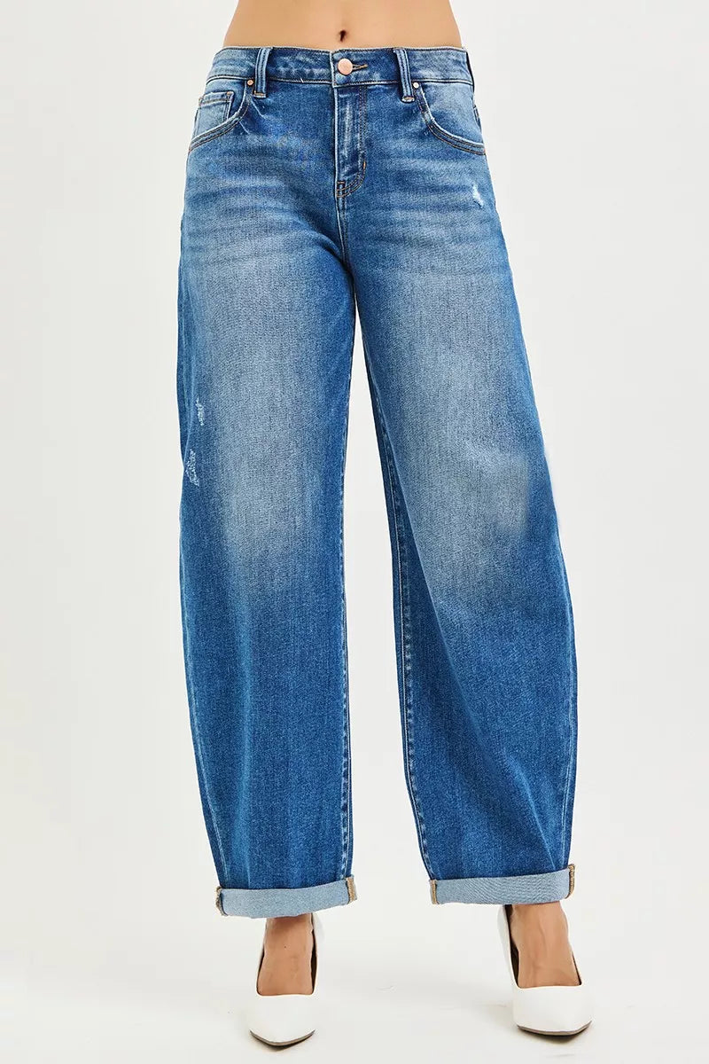 Front view of mid-rise barrel jeans with double roll-up cuffs and distressing