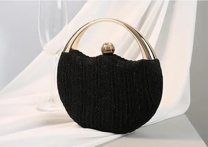 black round clutch bag clean structured minimalist design