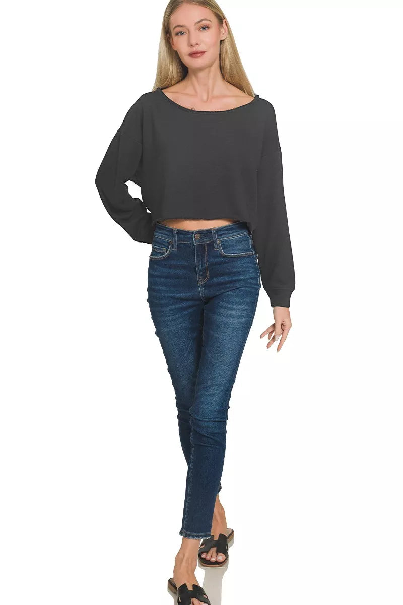 Close-up of boatneck design and fabric texture on cropped top