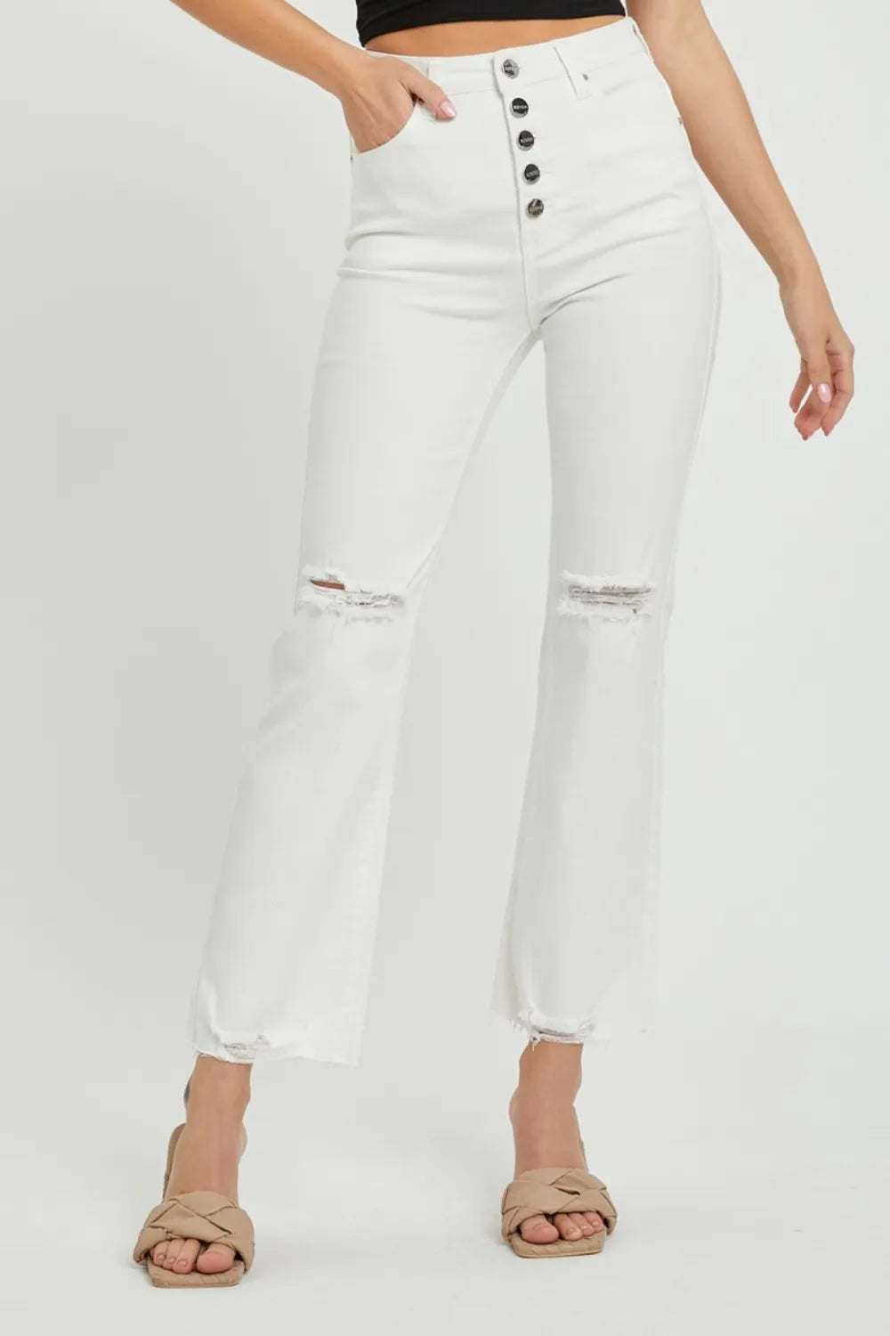 Front view of high-rise straight ankle jeans with exposed button fly