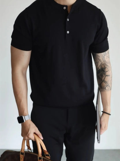 Close-up of button detail on short sleeve T-shirt