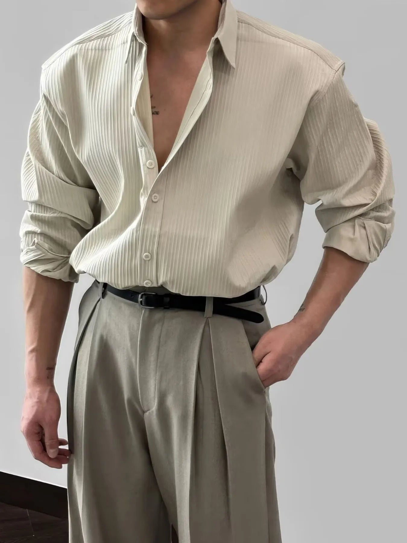 Model wearing classic button-up long sleeve shirt styled casually