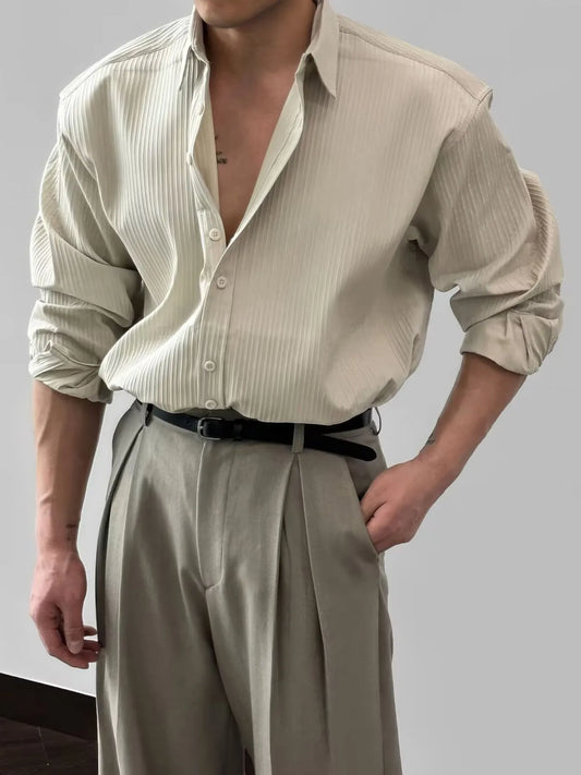 Model wearing classic button-up long sleeve shirt styled casually