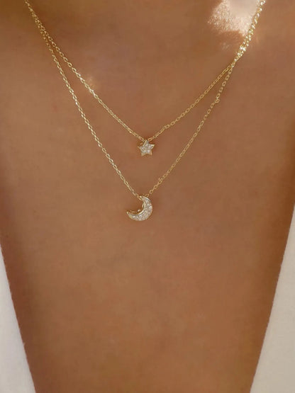 Front view of the 18K gold-plated double layered star and moon necklace