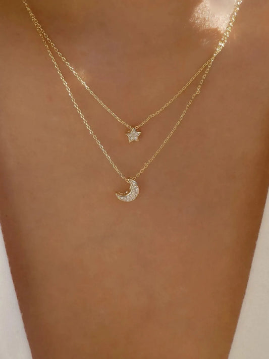 Front view of the 18K gold-plated double layered star and moon necklace