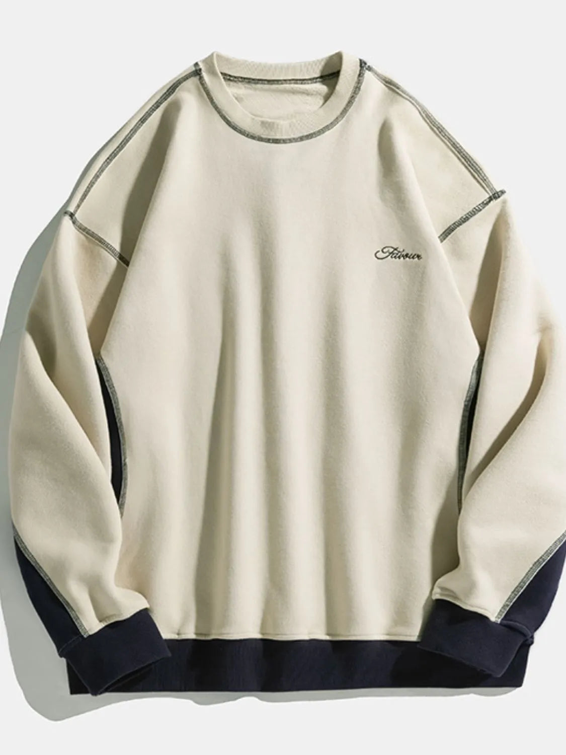 Model wearing contrast round neck drop shoulder sweatshirt styled casually