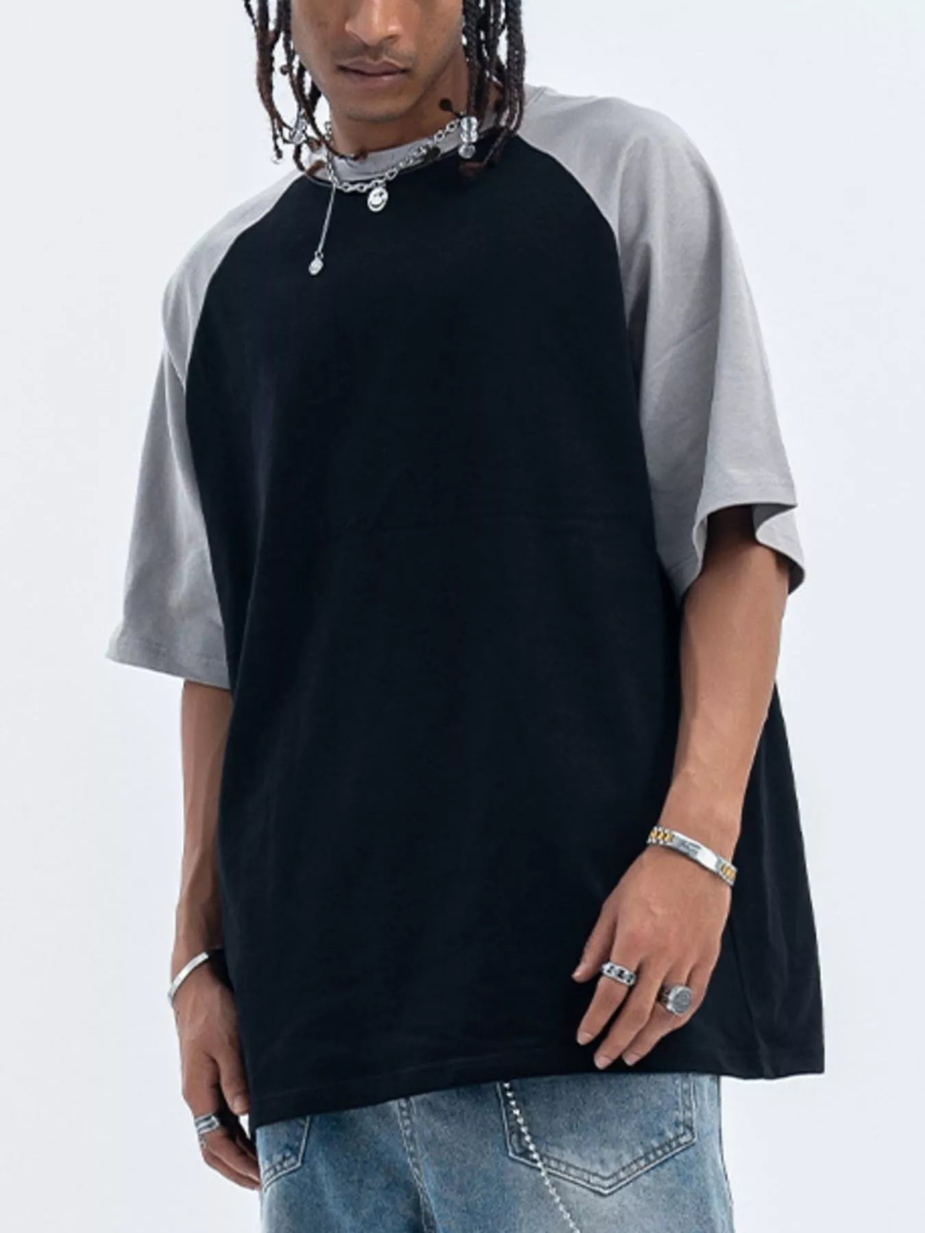 Close-up of contrast stitching detail on round neck T-shirt