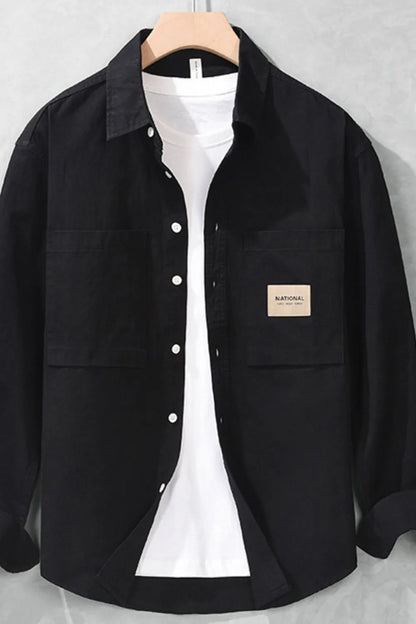 Close-up of fabric texture and button detail on long sleeve shirt