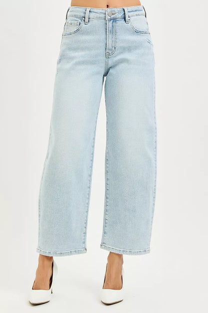 Close-up of the tapered cropped hem and premium denim texture