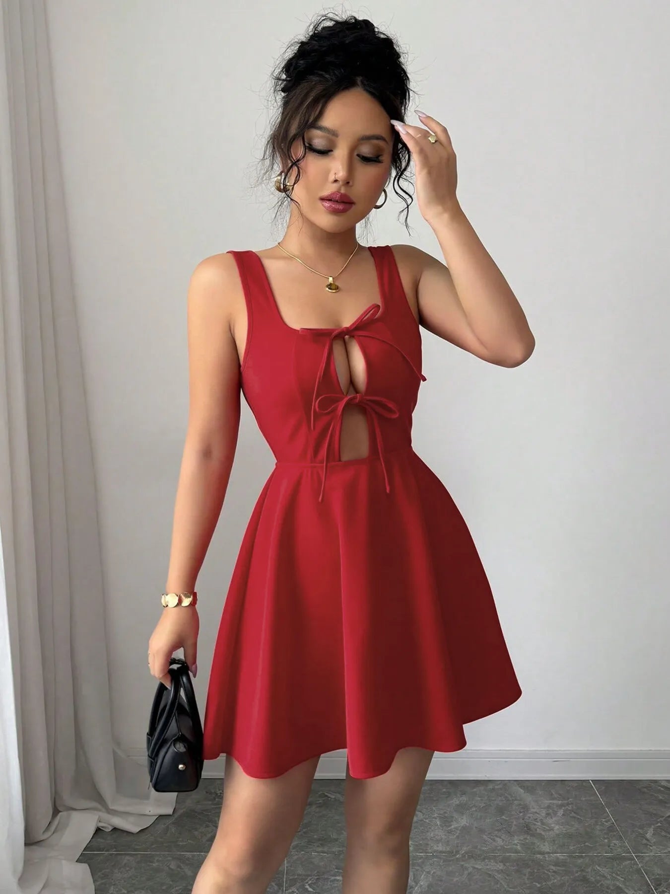 Model wearing the tie-front midi dress styled for a luxury coastal outing