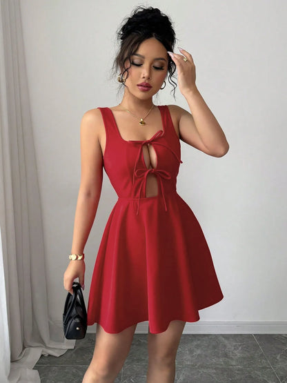 Model wearing the tie-front midi dress styled for a luxury coastal outing