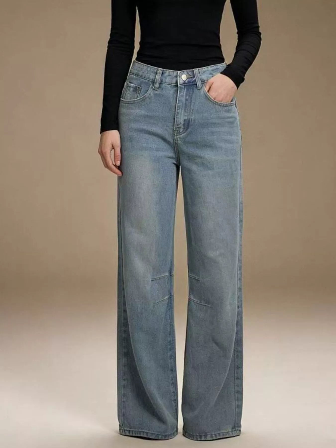 Close up of washed denim texture and button detail