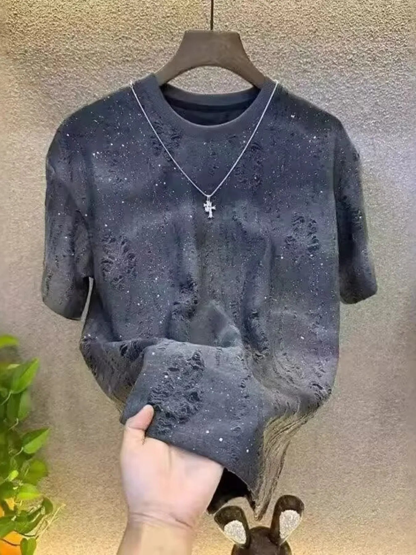 Close-up of distressed texture on cotton short sleeve T-shirt