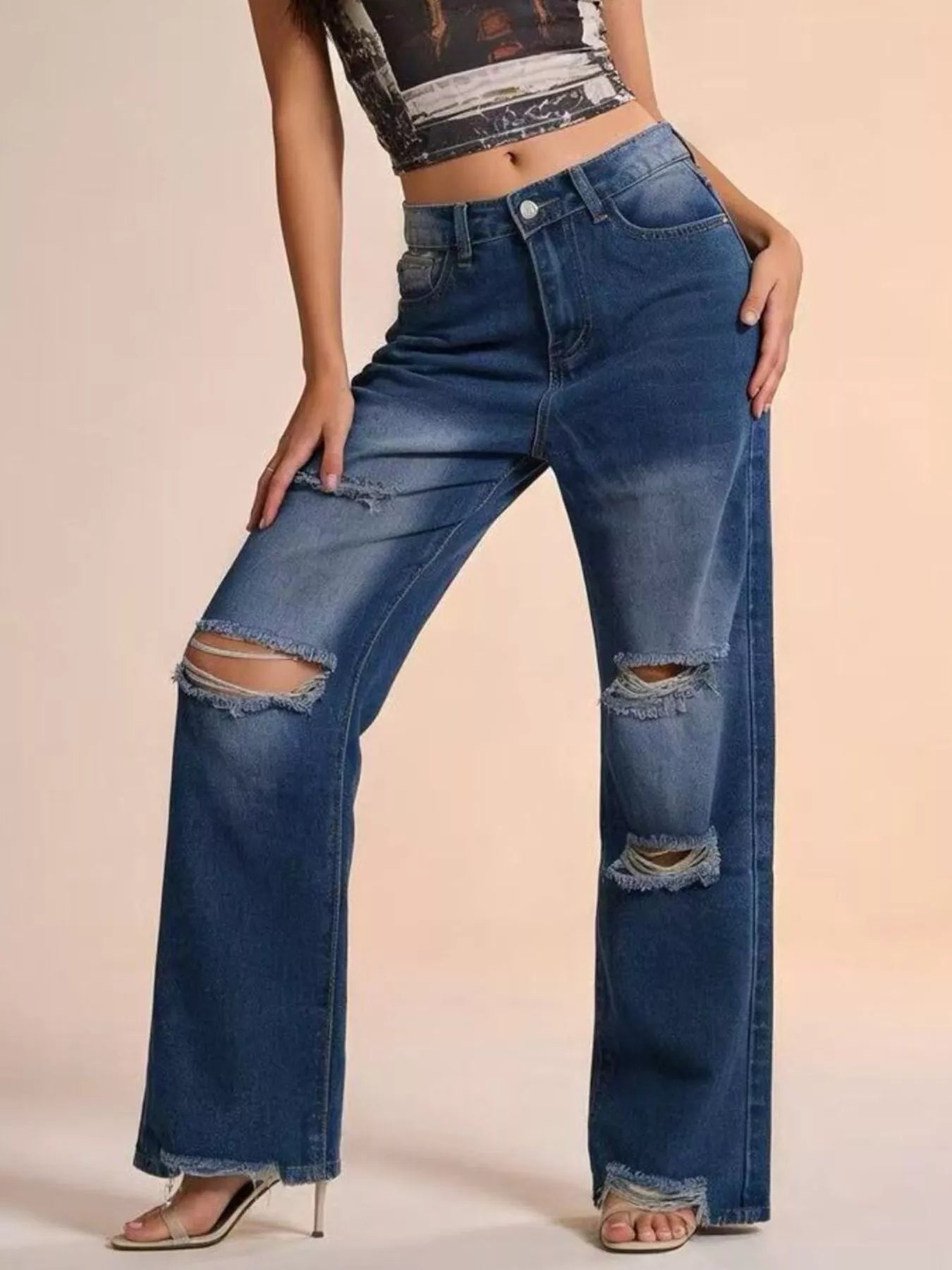Front view of distressed wide leg jeans with authentic vintage wash