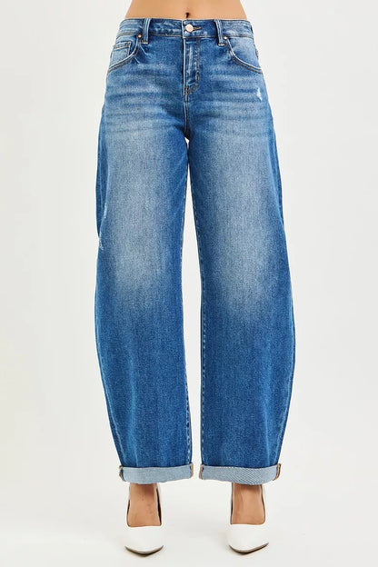Close-up of the double roll-up cuff and distressed denim texture