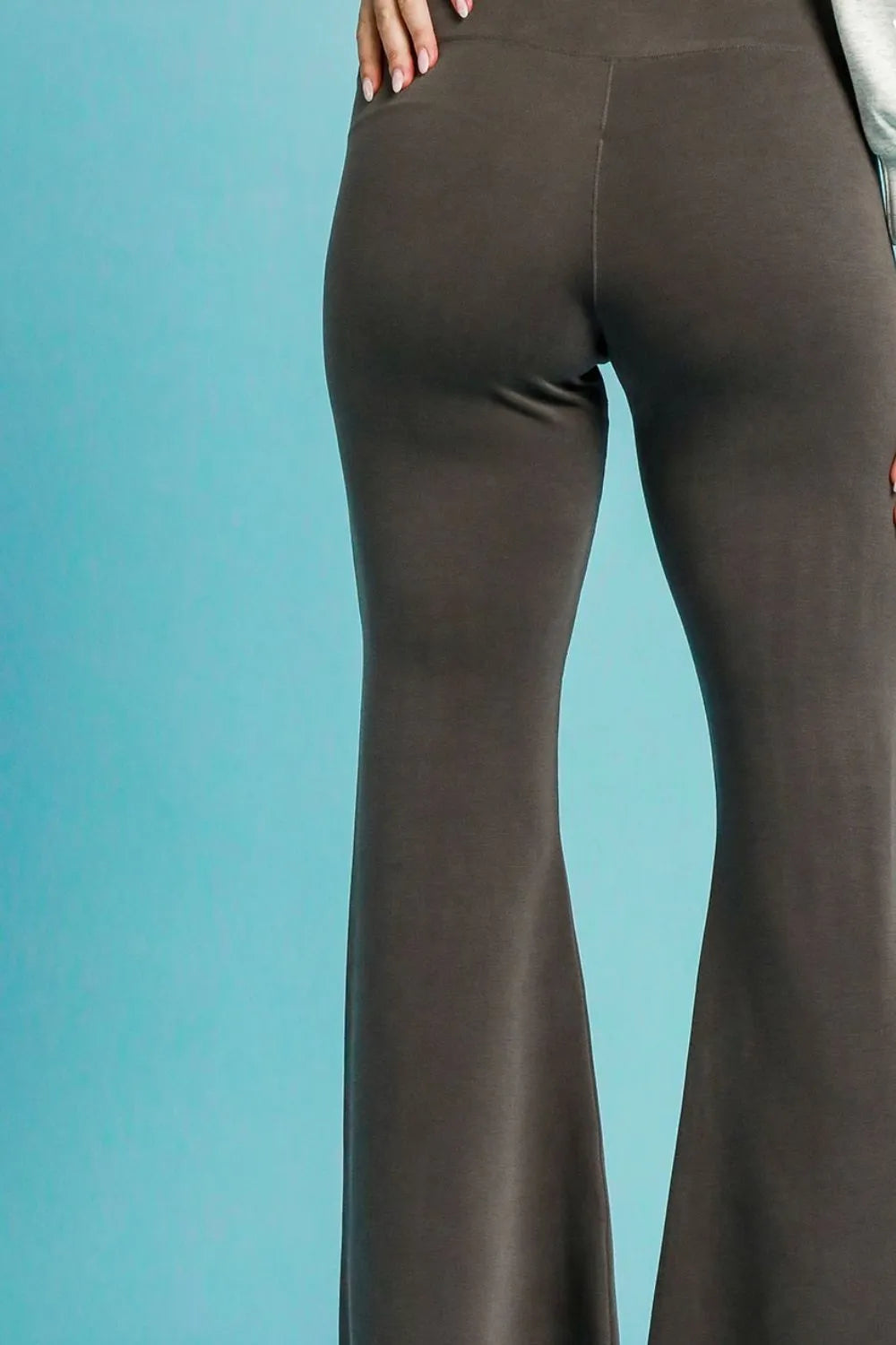 Close-up of the adjustable drawstring closure and architectural flare hem