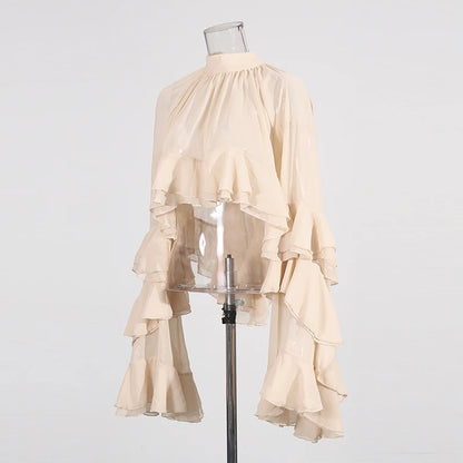Detail of long sleeves and subtle stretch on luxury loose fit ruffled blouse
