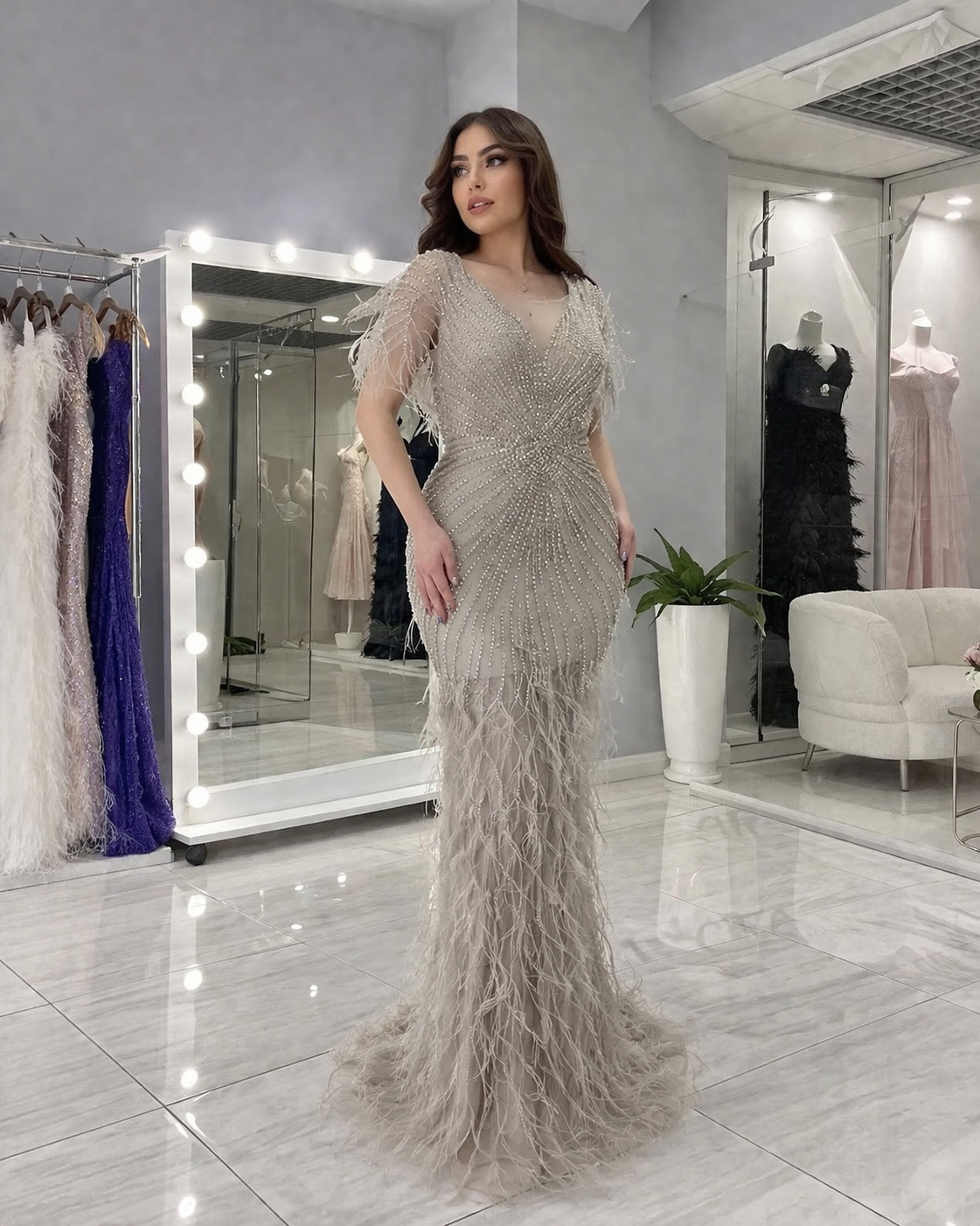 Model wearing the feather-trimmed evening dress at a high-profile formal gala