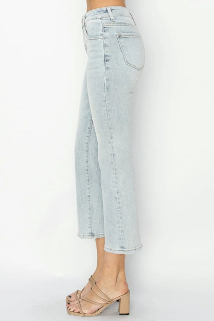 Close-up of the architectural flare hem and premium washed denim texture