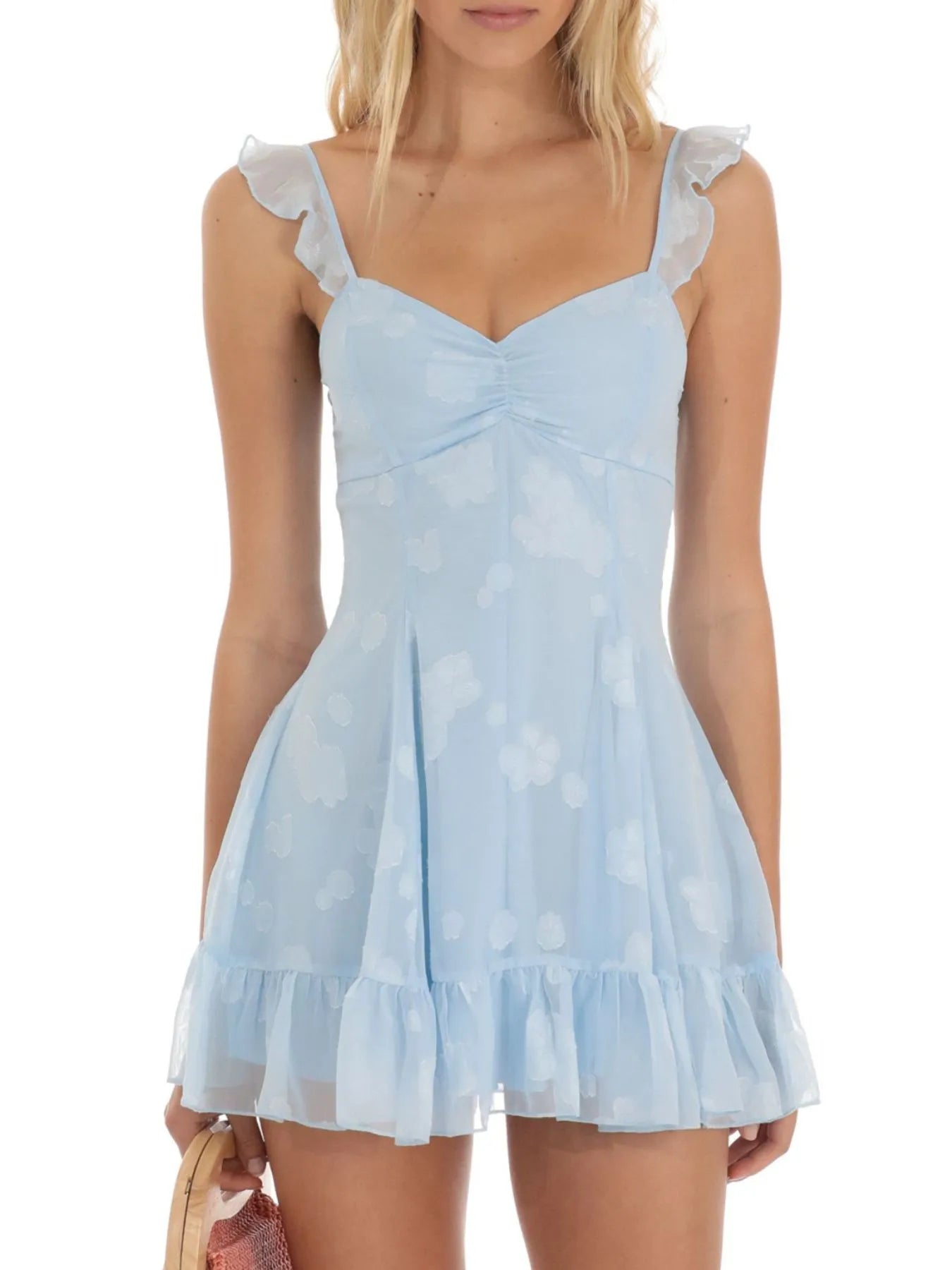Close up of ruffle and cutout detail on floral mini dress