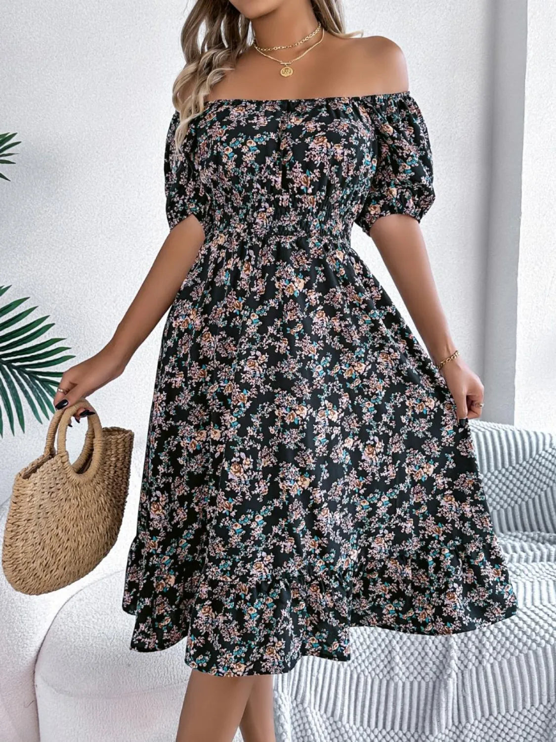 Model wearing ruffled hem floral dress styled for an outdoor social event