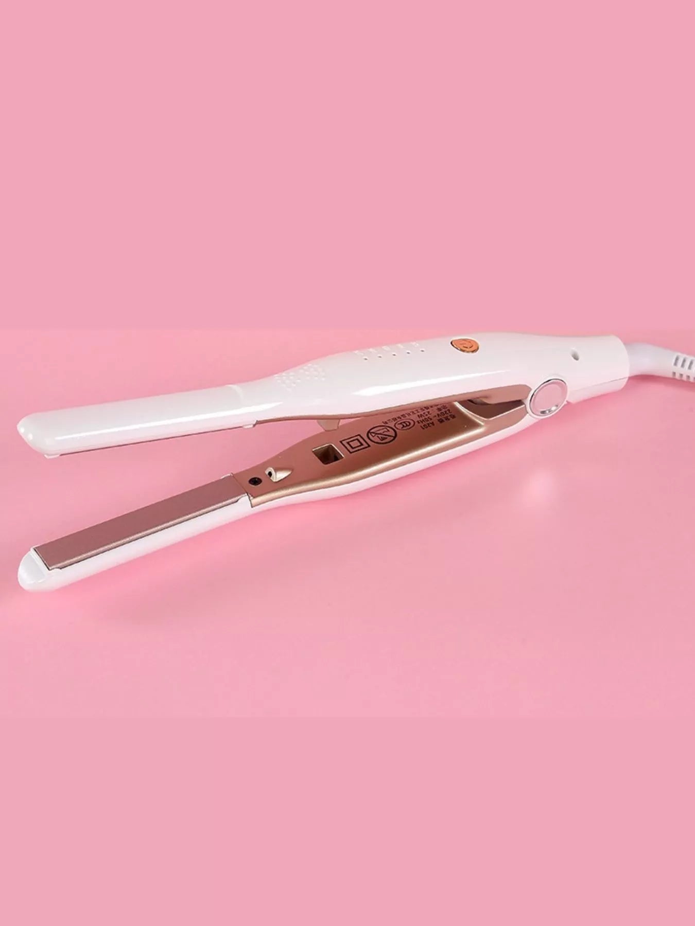 Woman using 2 in 1 hair straightener for styling