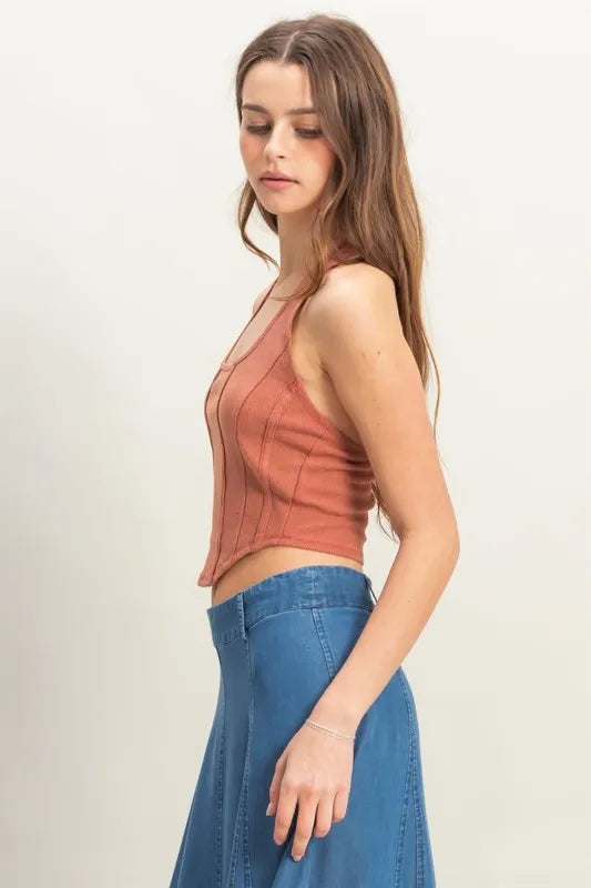 Model wearing mineral wash halter top styled with neutral trousers