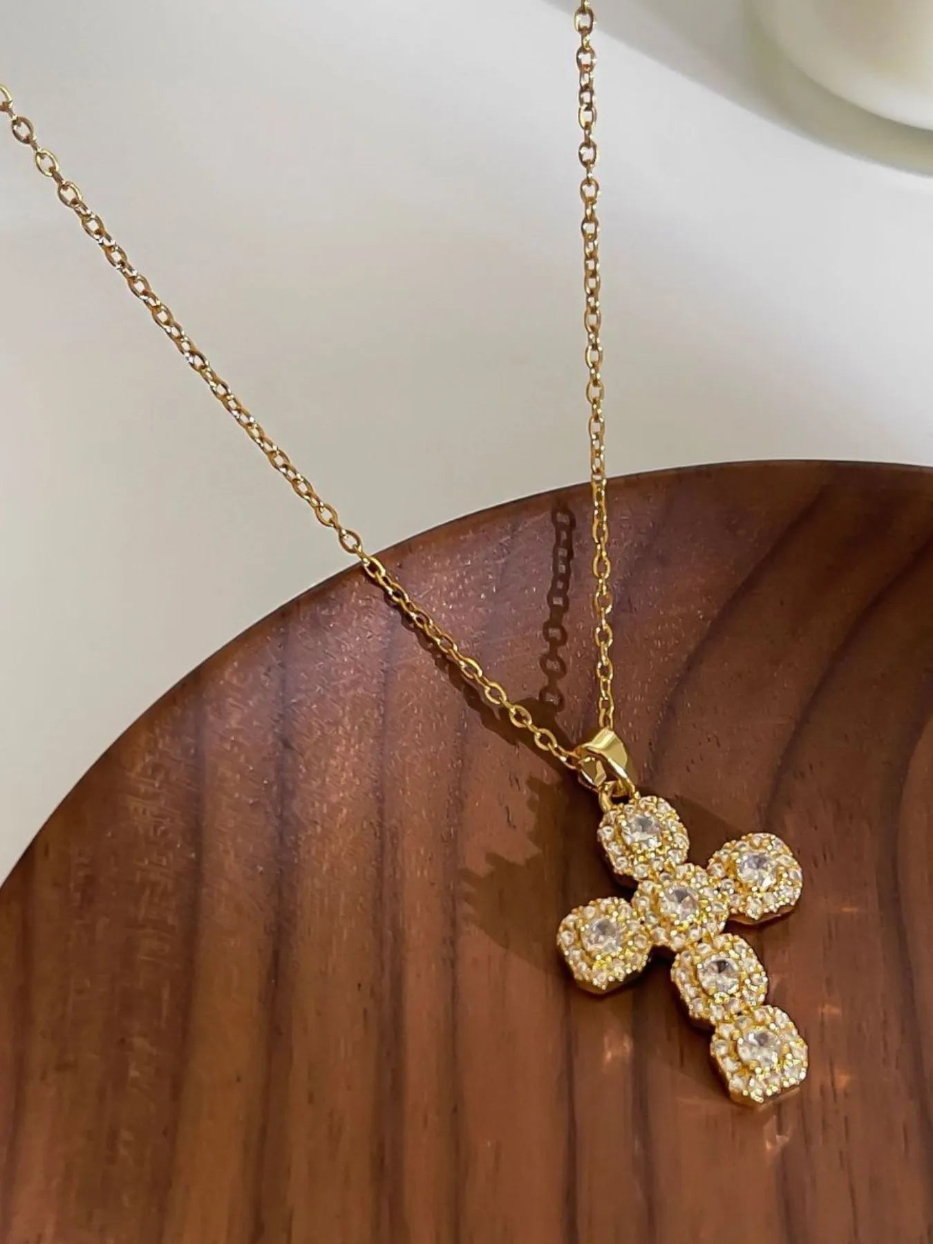Close-up of the brilliant inlaid zircon stones and the high-luster 14K gold finish