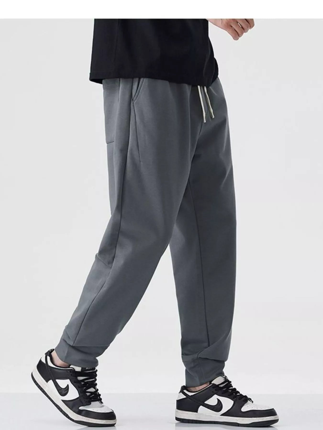 Close-up of drawstring waistband on cotton blend joggers