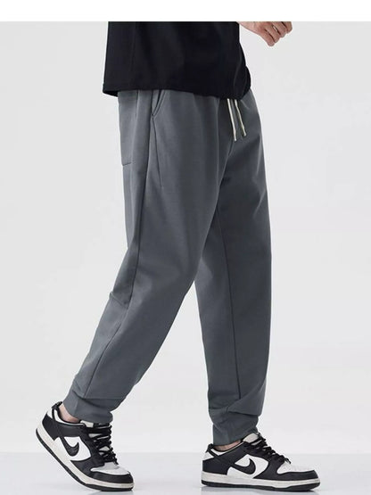 Close-up of drawstring waistband on cotton blend joggers