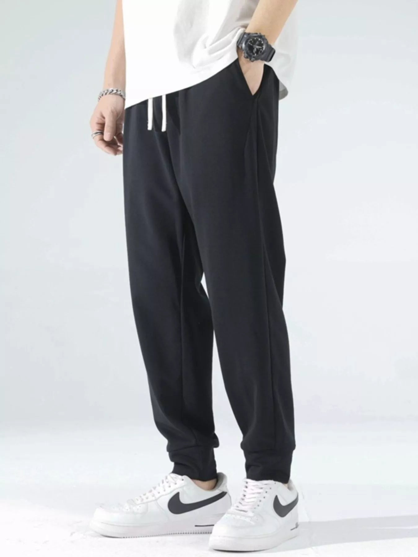 Model wearing casual drawstring joggers styled for everyday wear