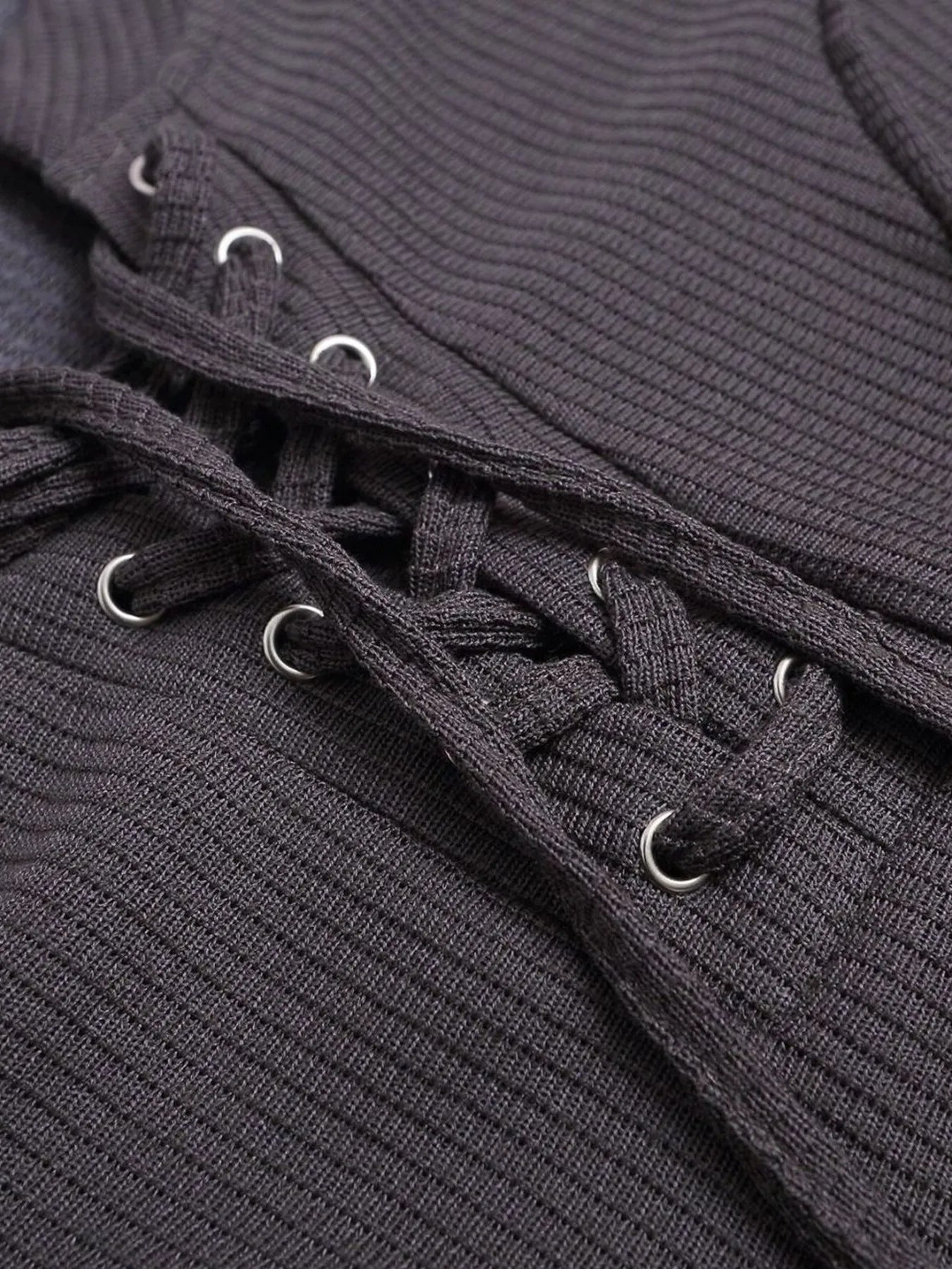Close-up of lace-up neckline and ribbed texture on short sleeve T-shirt