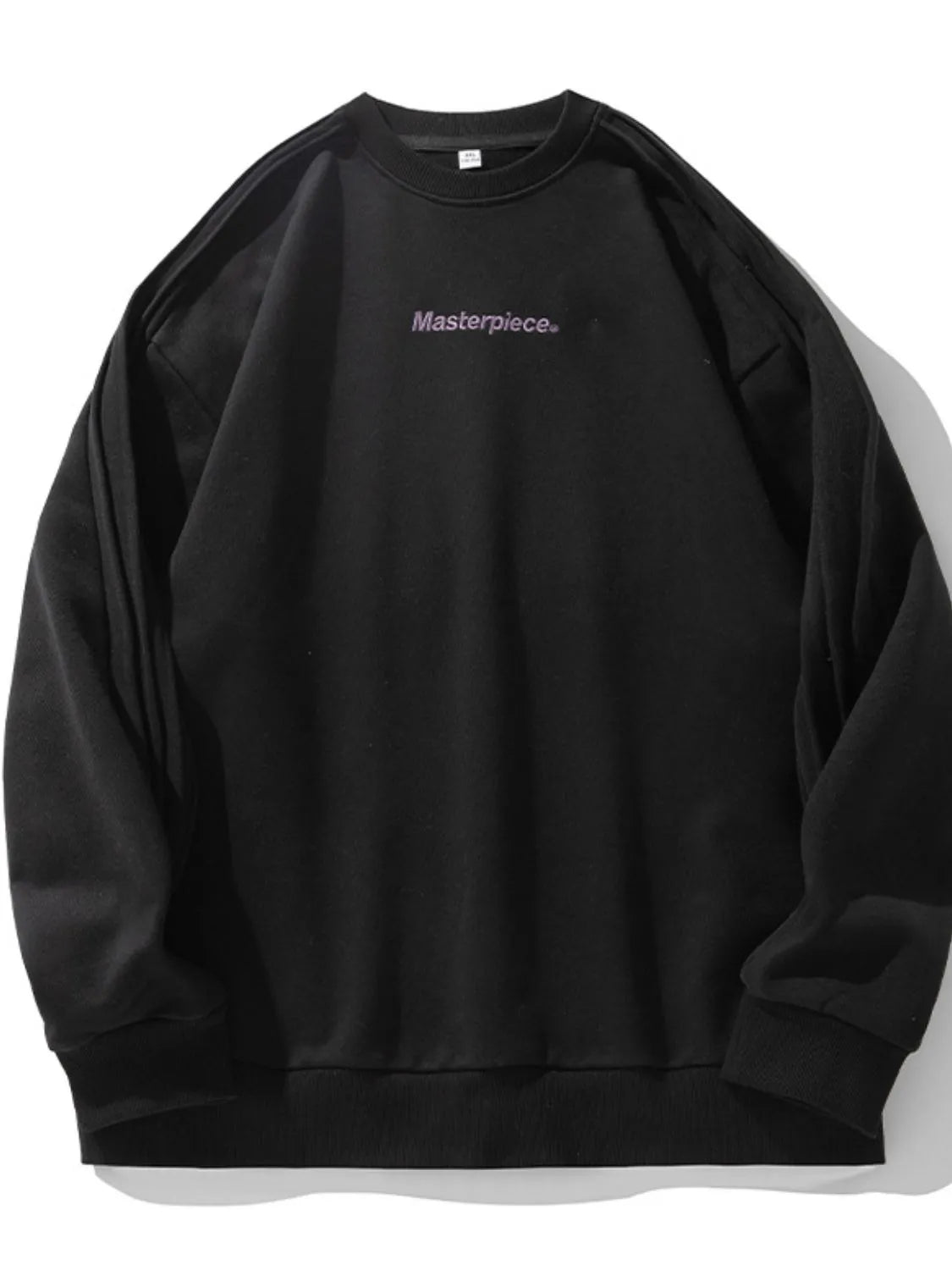 Close-up of letter graphic print on round neck sweatshirt