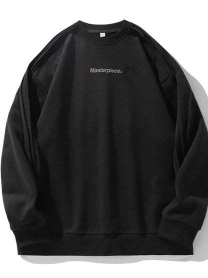 Close-up of letter graphic print on round neck sweatshirt
