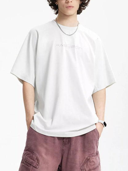 Close-up of graphic letter print on round neck half sleeve T-shirt
