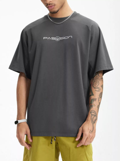 Model wearing graphic letter round neck half sleeve T-shirt styled casually