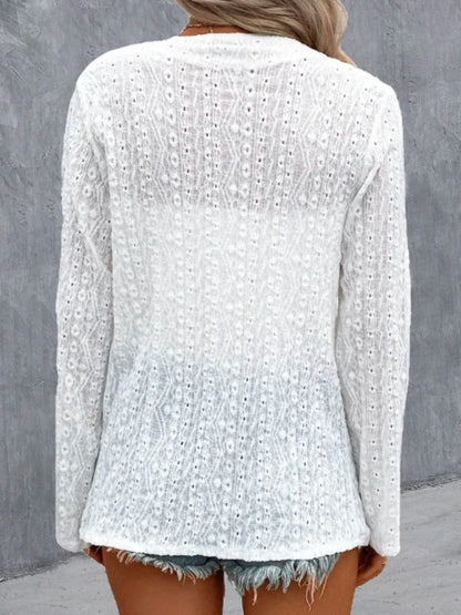 Woman wearing lightweight eyelet open front cardigan styled for spring outfit