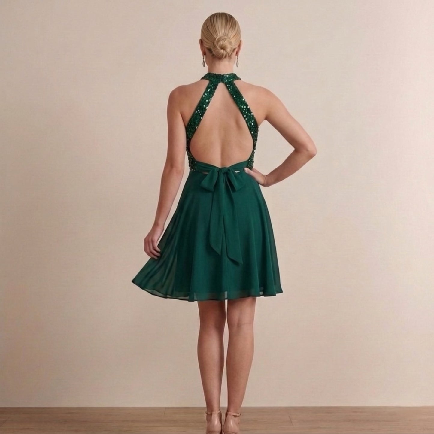 Back view of sleeveless halter dress showing refined fit and structure