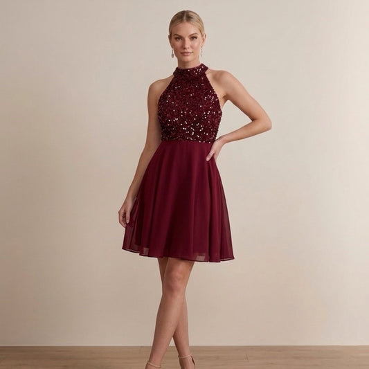 Front view of elegant beaded halter midi dress with fitted silhouette for women