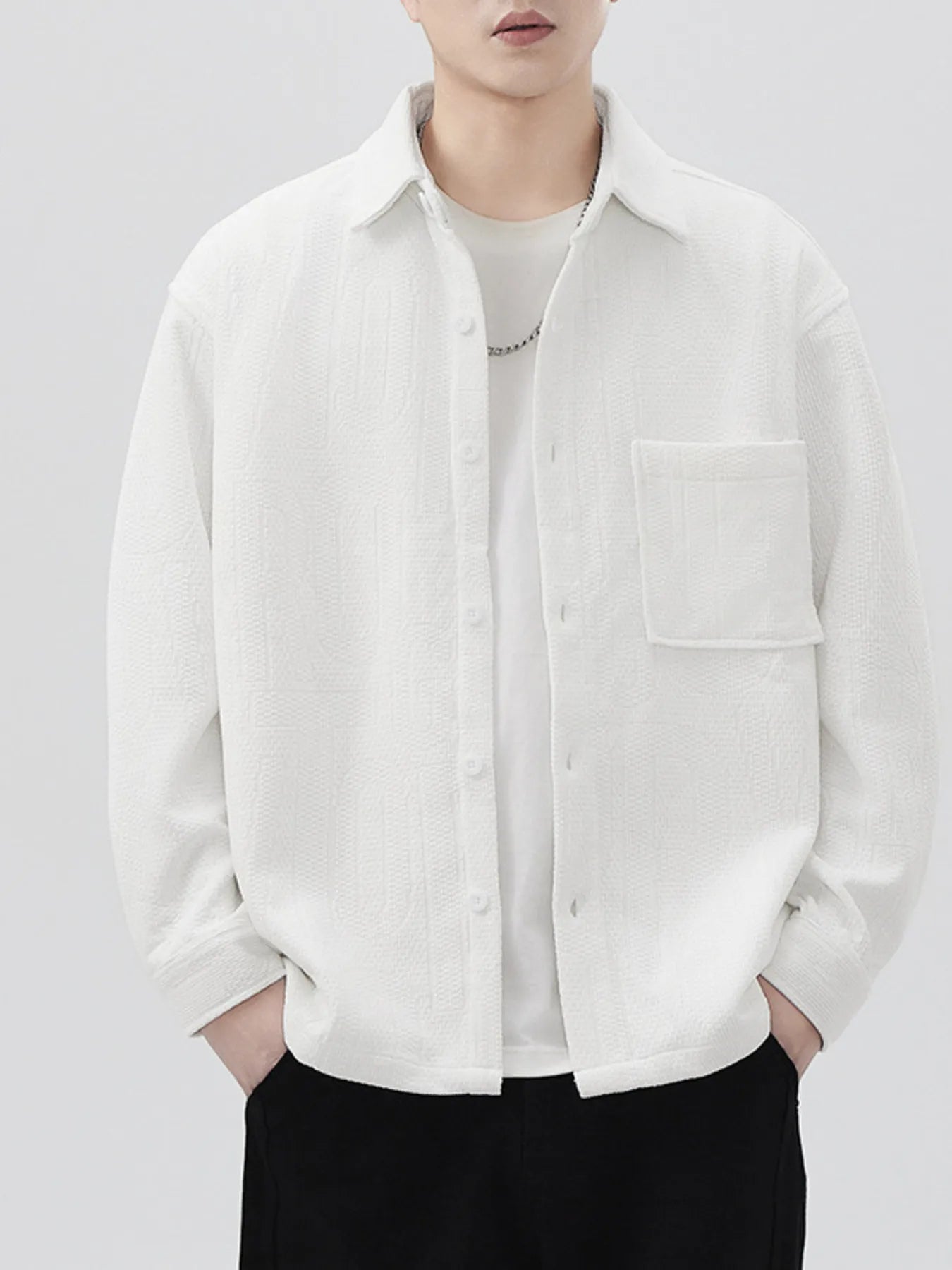Back view of oversized men’s long sleeve button-up shirt