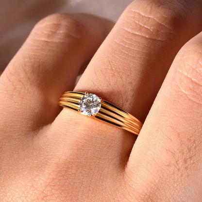 Close-up of the brilliant 0.5ct moissanite and the high-luster 18K gold prong setting