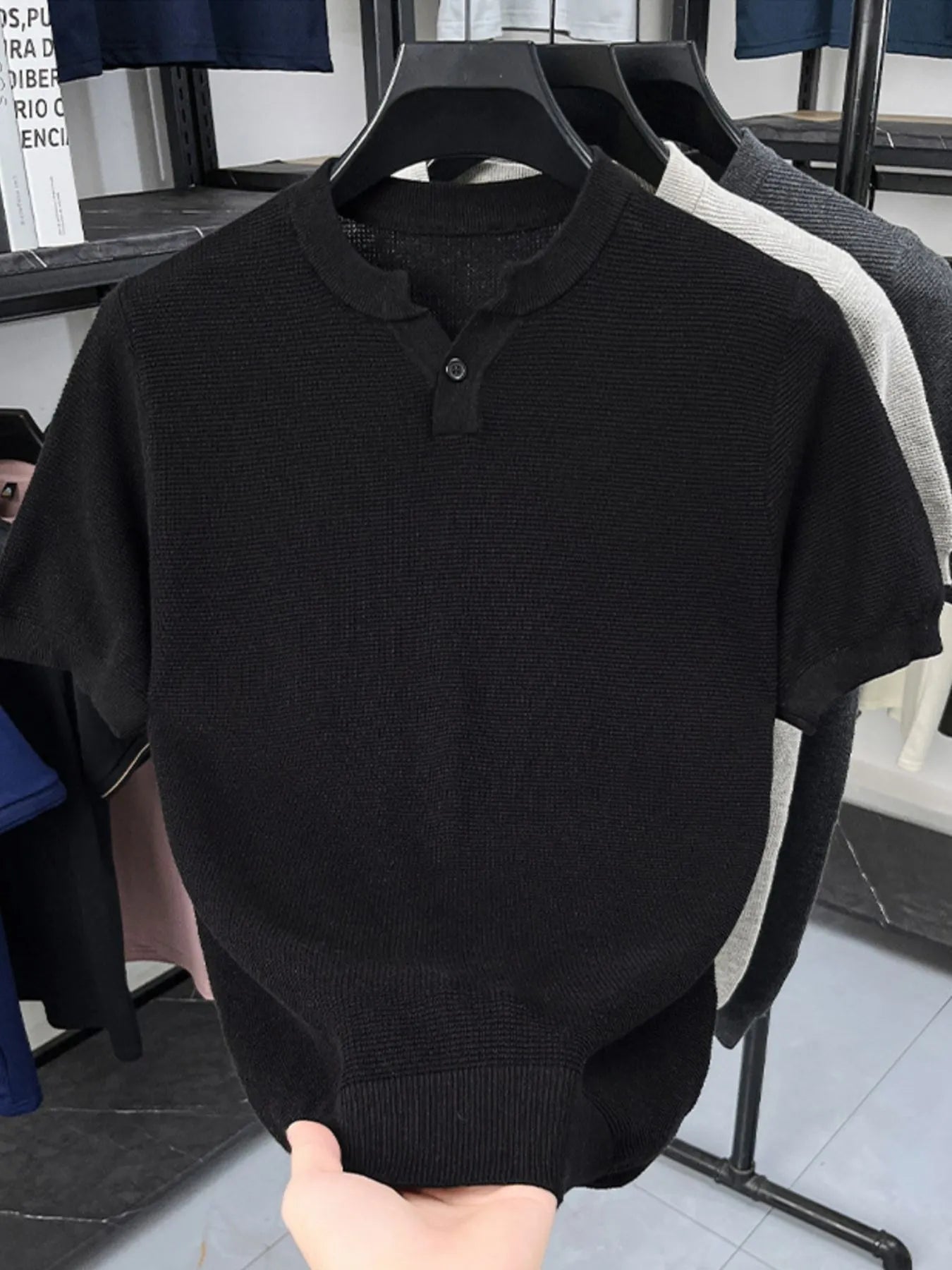 Close-up of ribbed texture and buttoned notched neckline on T-shirt