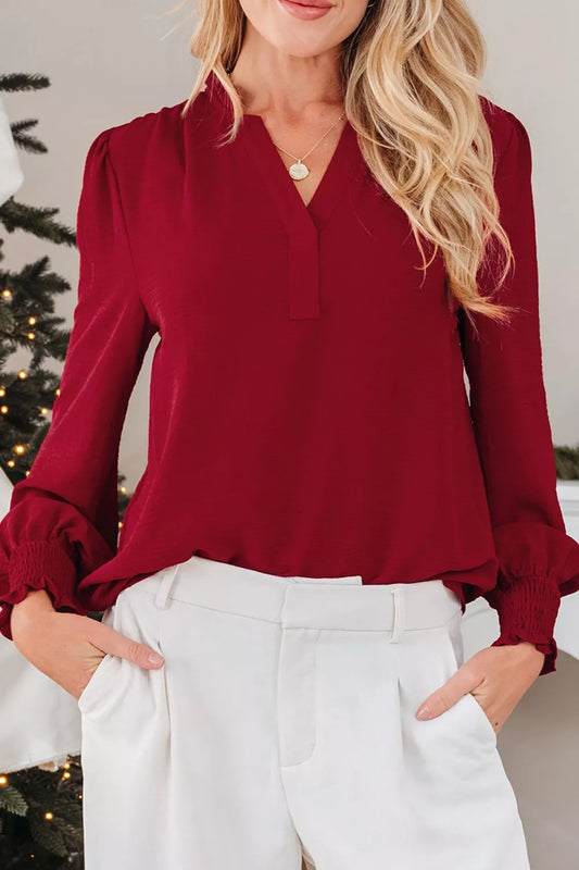 Front view of the notched neck long sleeve blouse with frill detailing