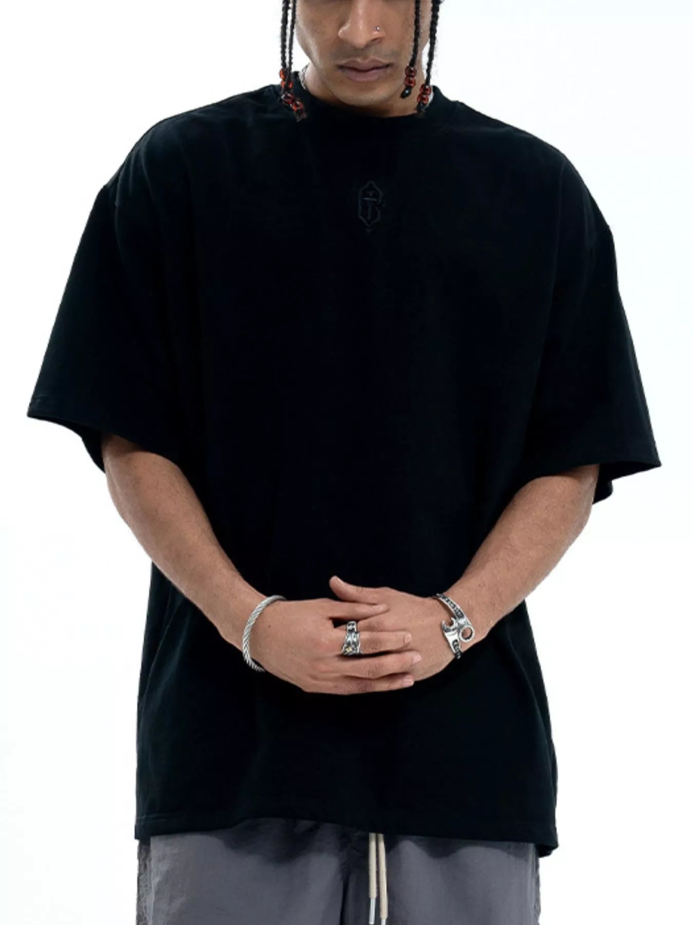 Model wearing oversized cotton round neck half sleeve T-shirt styled casually