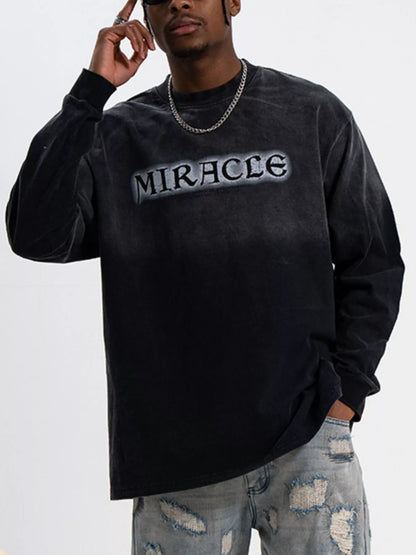 Front view of oversized letter graphic long sleeve T-shirt